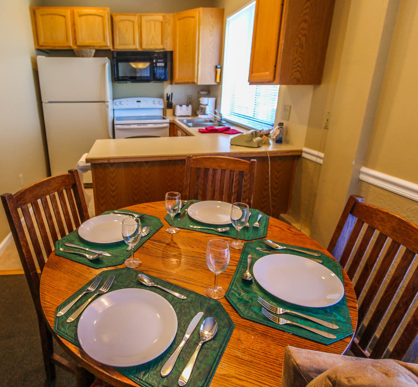 A fully equipped kitchen and dining room at VRI's Powder Ridge Village in Eden, Utah.